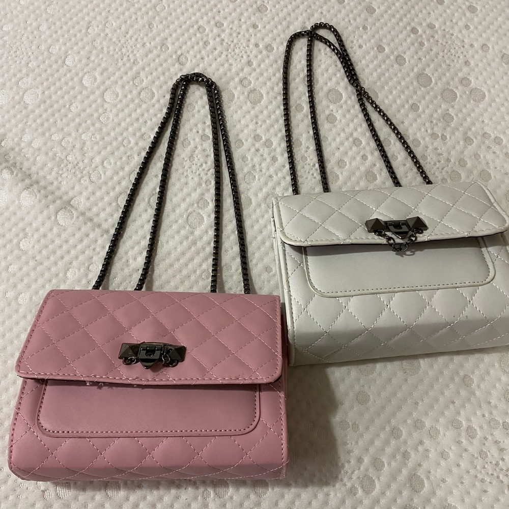 Pink and white purses